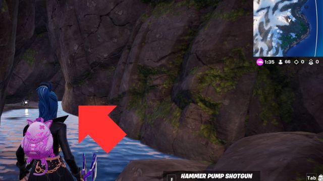 Fortnite player in secret cave with arrow pointing to location.