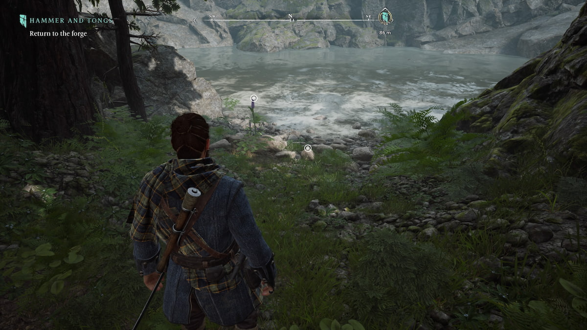 a man in adventuring gear looking at a river