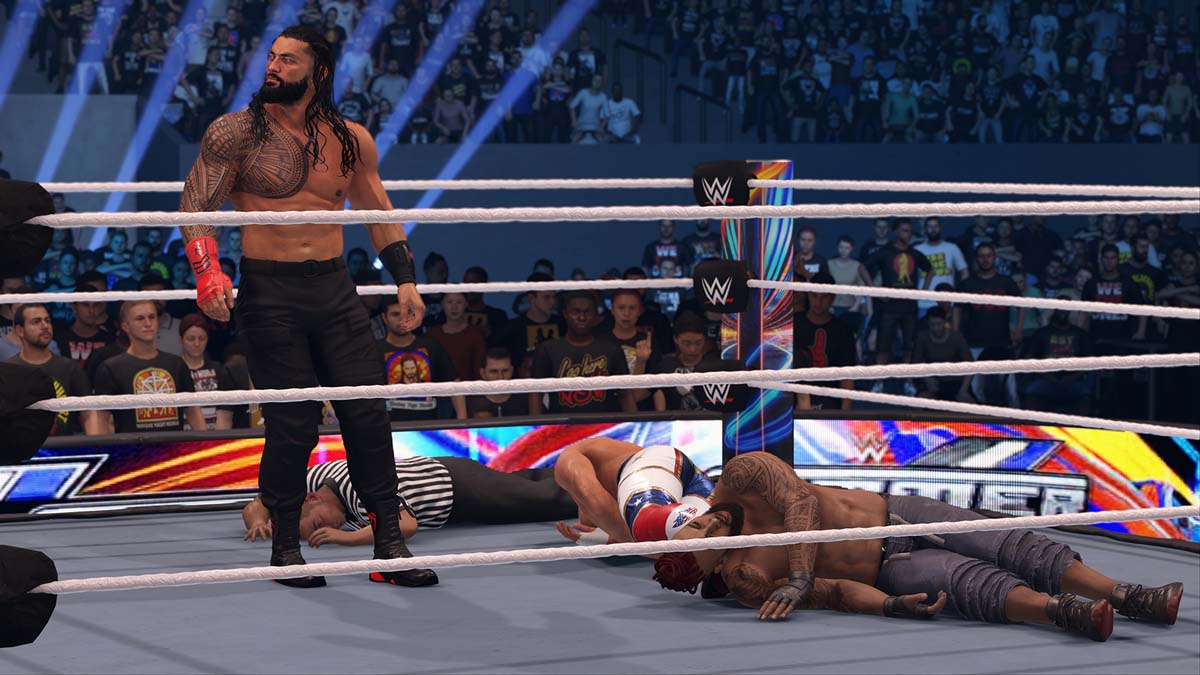 A couple of wrestlers knocked out on the ringside in WWE 2K24