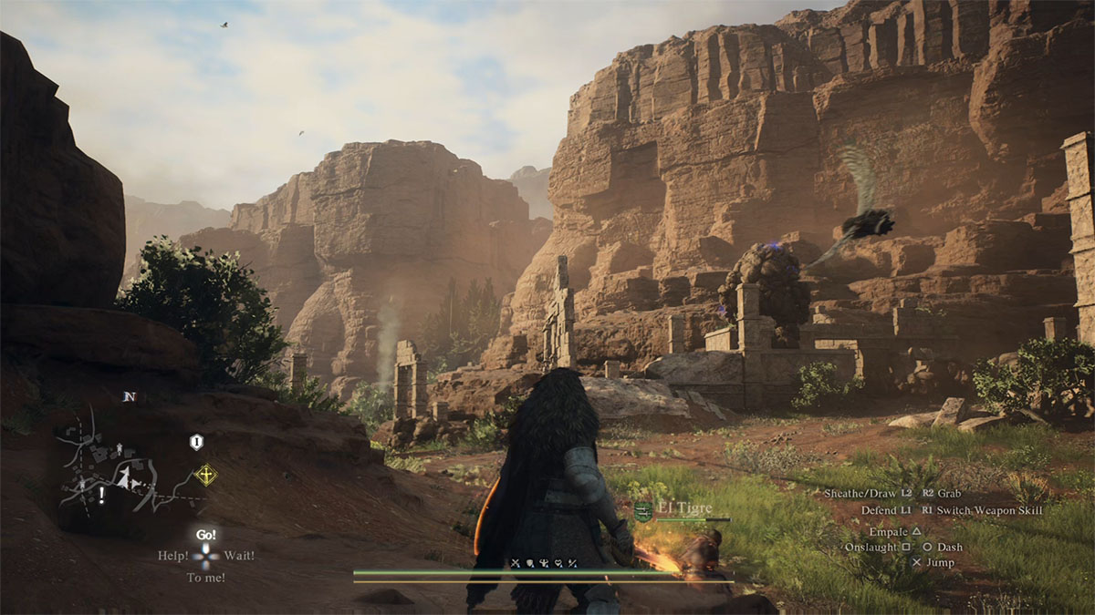 the arisen exploring the deserts of batthal while a harpy circles them and a stone golem is visible in the distance