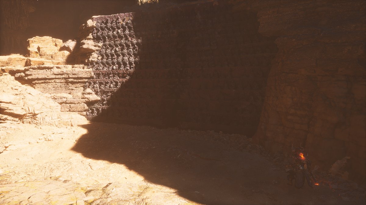 A decorated wall against a desert backdrop in Black Myth: Wukong.