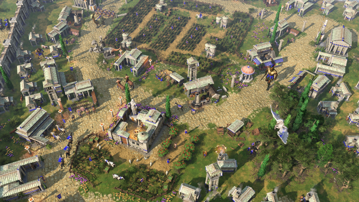 A screenshot of Age Of Mythology: Retold showing a view from a above of a city from the Fall of the Trident campaign.