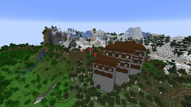 A Minecraft Woodland Mansion in front of a Frozen Peaks mountain