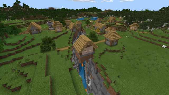 A Minecraft Plains Village on top of a ravine filled with lava