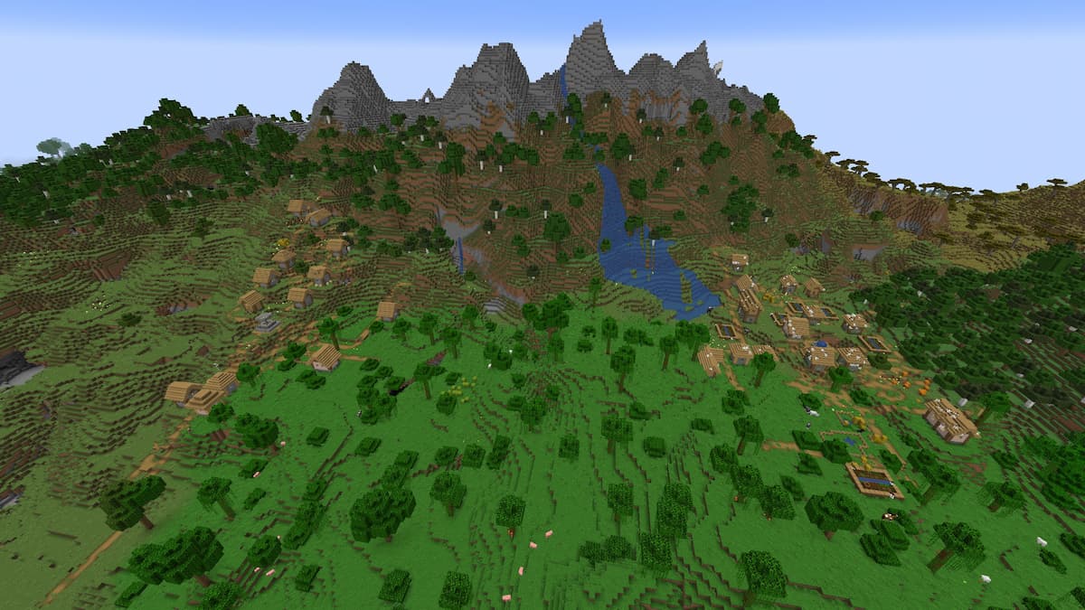 A Stony Peaks mountain behind two Plains Villages in Minecraft