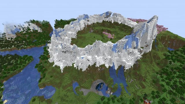 A Minecraft mountain with a Cherry Grove, a cavern, and a ruined Nether portal